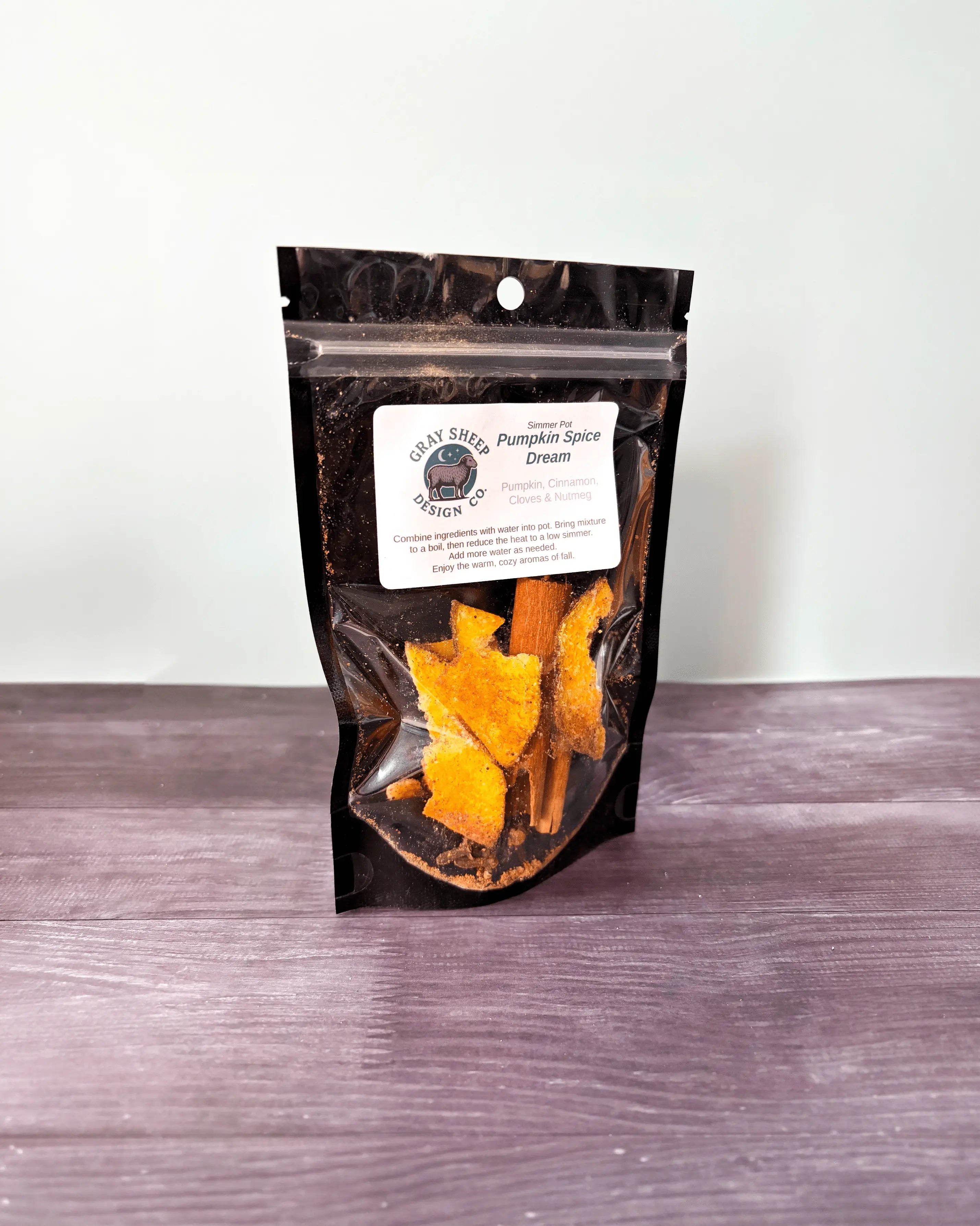 Pumpkin Spice Dream simmer pot in a resealable black pouch, dried pumpkin and cinnamon visible through the window.